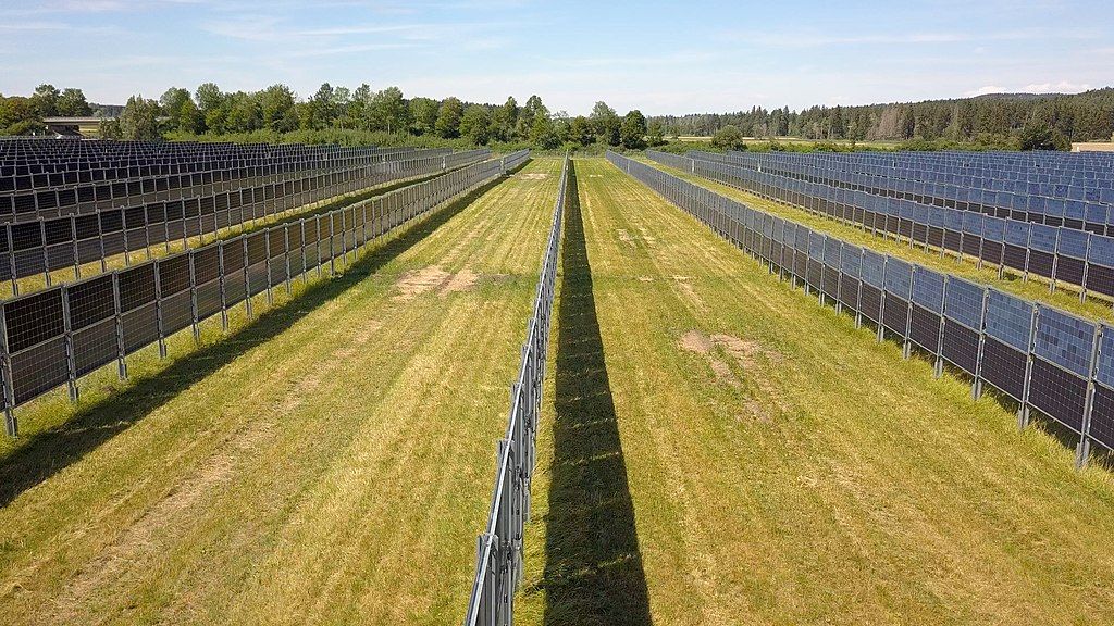 English Aerial picture of an agrivoltaics solar plant with walls of vertical bifacial modules near Aasen, Donaueschingen Germany